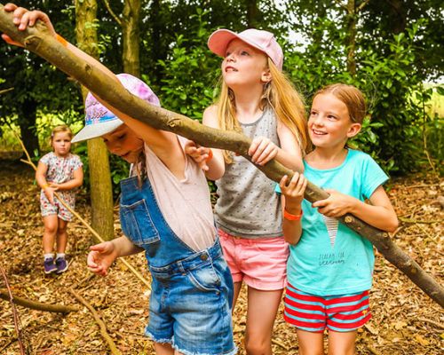 Girls with a stick at William's Den